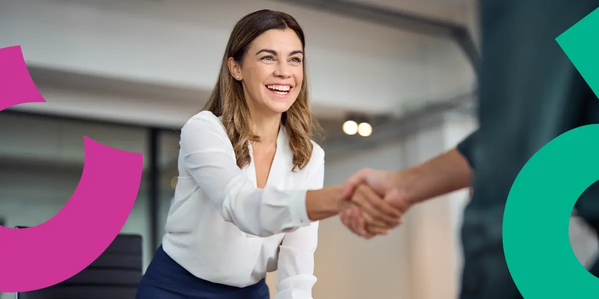 Woman shaking hands with a man