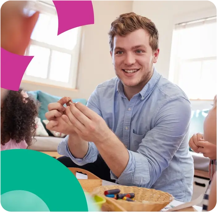 Man in a shirt working in a nursery school